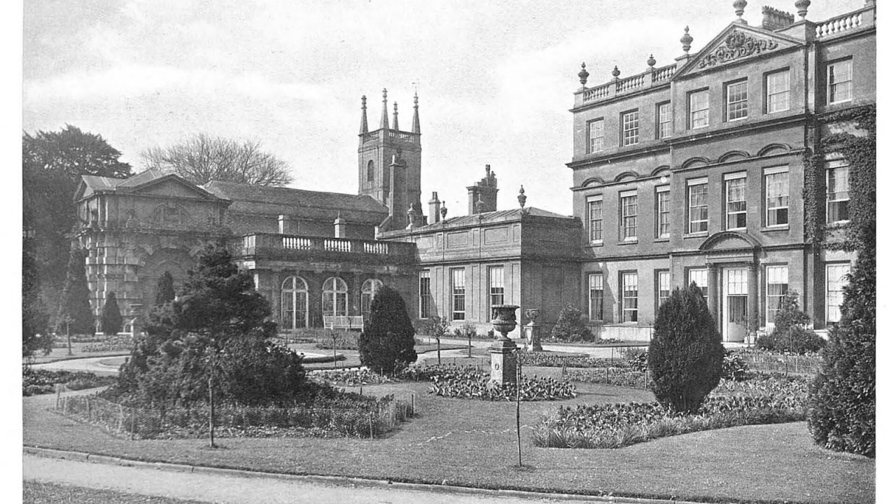Black-and-white photo of the east front of Badminton House, Gloucestershire, from the early 1900s