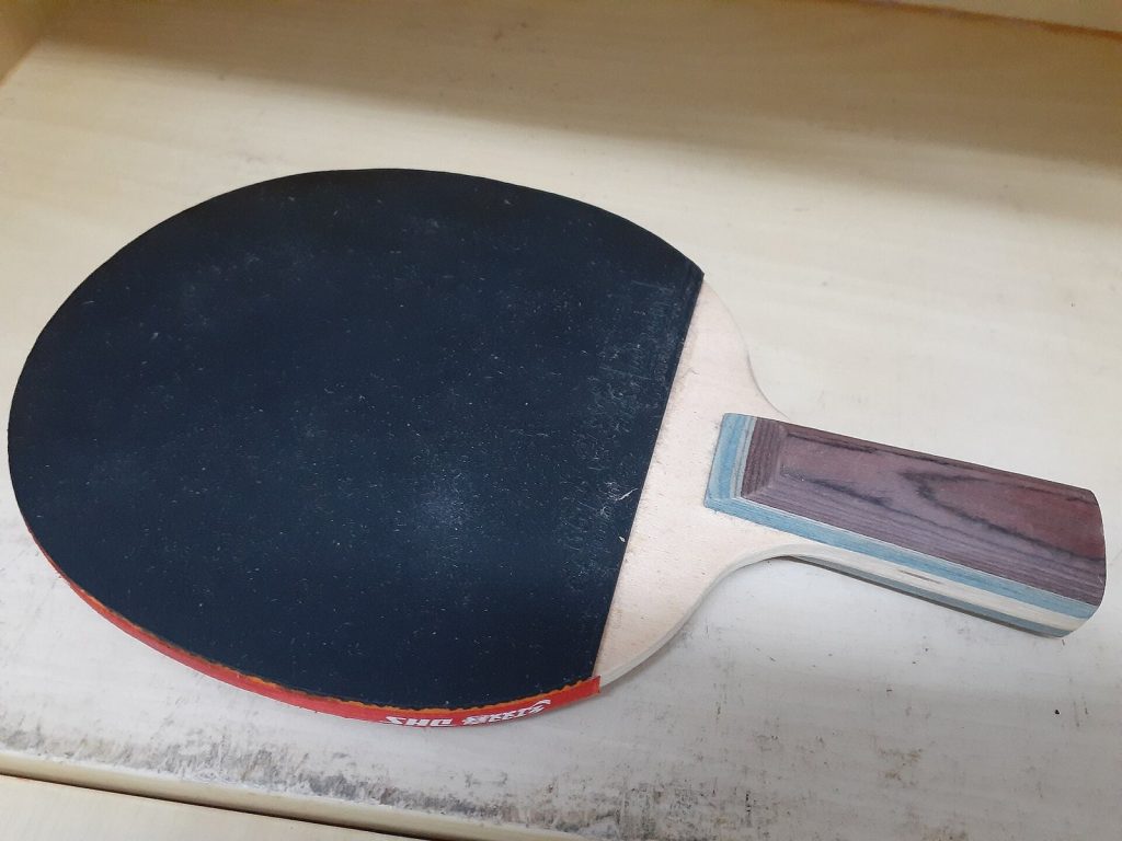 A pre-made table tennis racket photographed close up