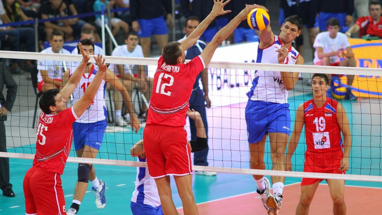 An attacker spiking against a double block at the net during Bulgaria v Serbia in Sofia