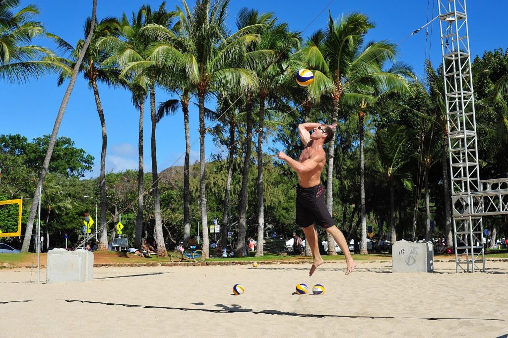 Player jumping to hit a float serve overhand after a short approach